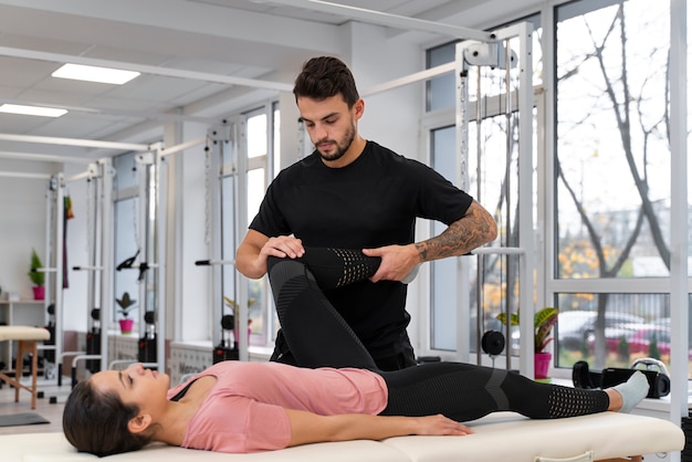 Medium shot man helping patient recover