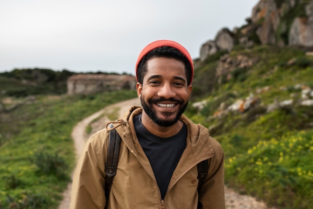 Free photo medium shot man on hiking tour