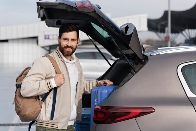 Medium shot man holding baggage