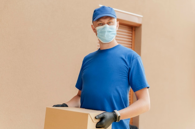 Medium shot man holding box