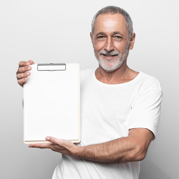 Medium shot man holding clipboard