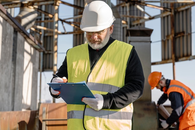 Medium shot man holding clipboard