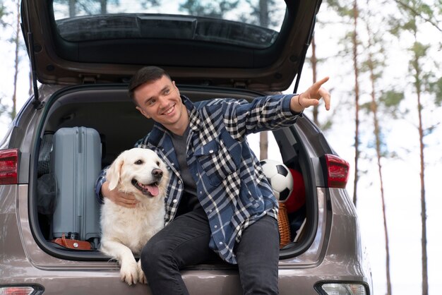 Medium shot man holding dog