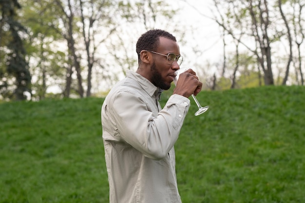 Medium shot man holding drink