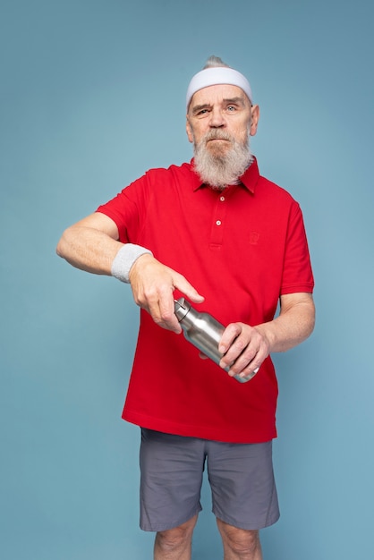 Free photo medium shot man holding flask