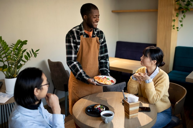 Free photo medium shot man holding food plate