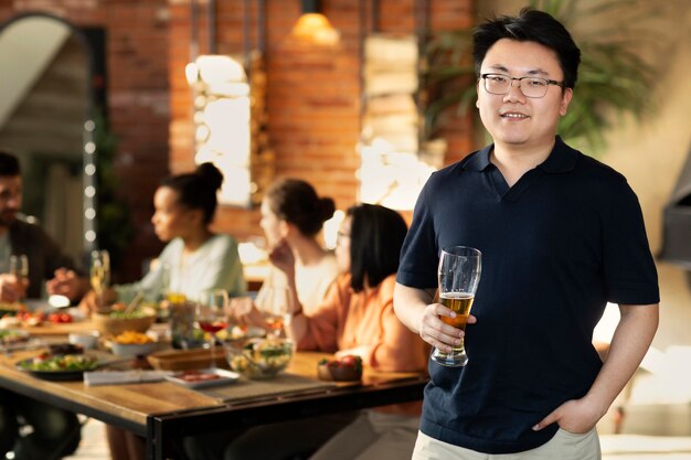 Medium shot man holding glass