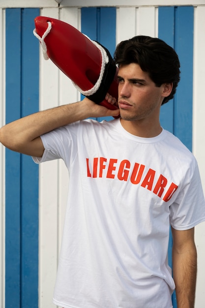 medium shot man holding lifesaving buoy
