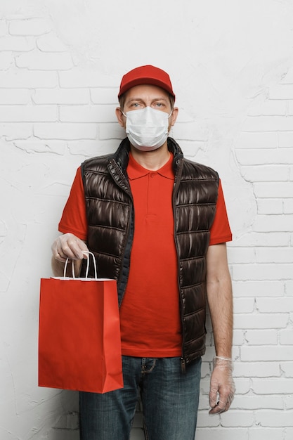 Medium shot man holding paper bag