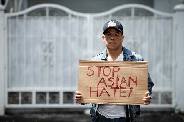 Medium shot man holding placard