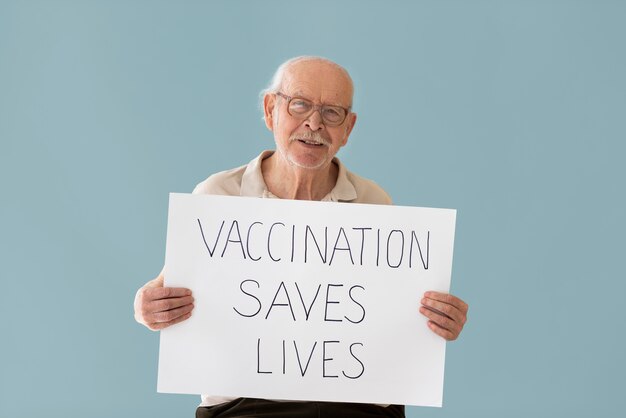 Medium shot man holding placard