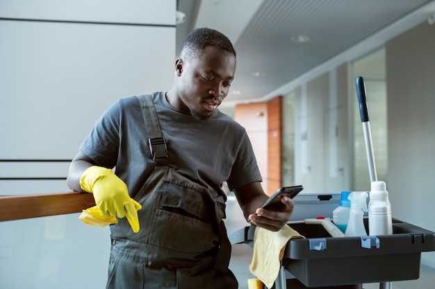 Medium shot man holding smartphones