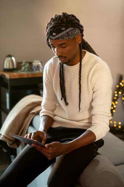 Medium shot man holding tablet