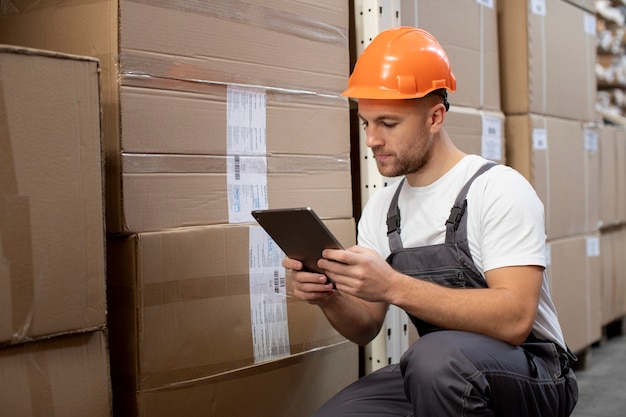 Medium shot man holding tablet