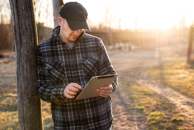 Medium shot man holding tablet