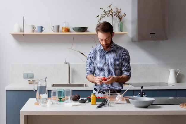 Medium shot man holding vegetable