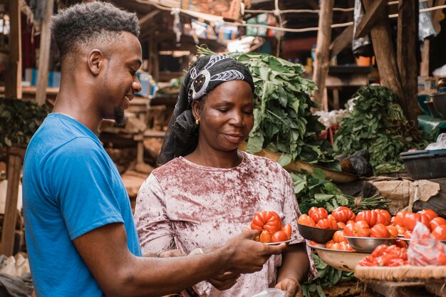 Medium shot man holding vegetables