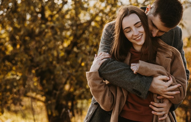 Medium shot man holding woman