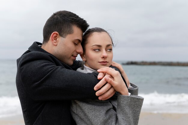 Medium shot man holding woman