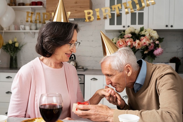 Medium shot man kissing woman's hand