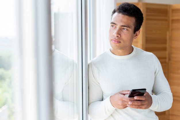 Free photo medium shot of man looking outside