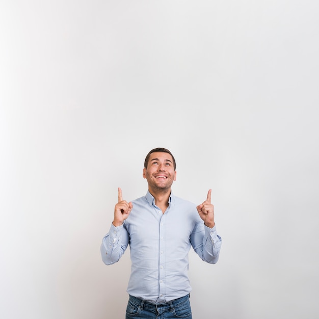 Medium shot of man looking up with copy space