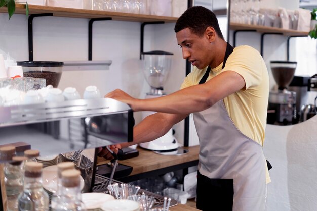 Medium shot man making coffee