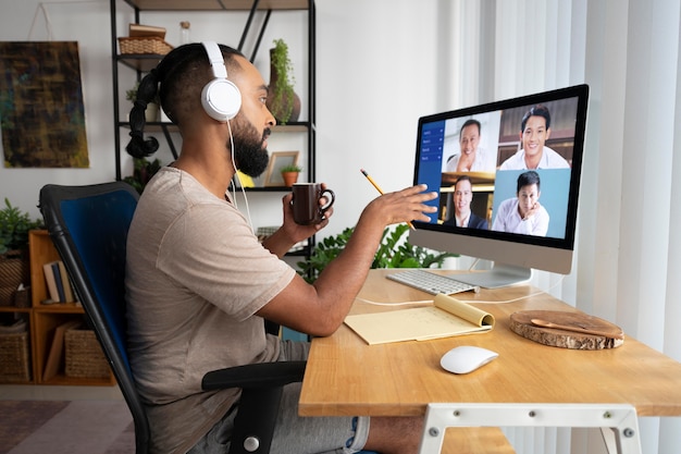 Medium shot man in meeting  at home