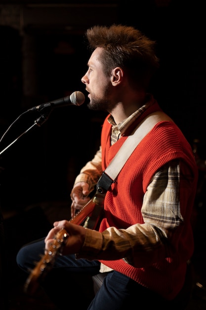 Medium shot man performing on stage