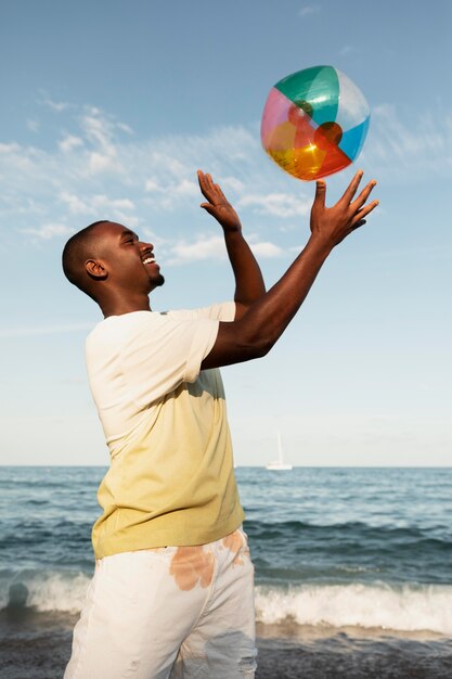 Medium shot man playing with ball