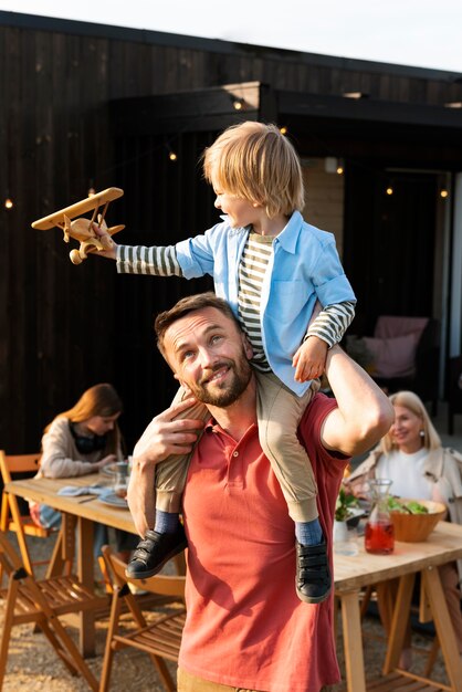 Medium shot man playing with kid