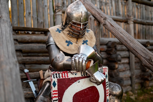 Free photo medium shot man posing as a medieval soldier