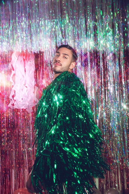 Medium shot man posing with cool jacket