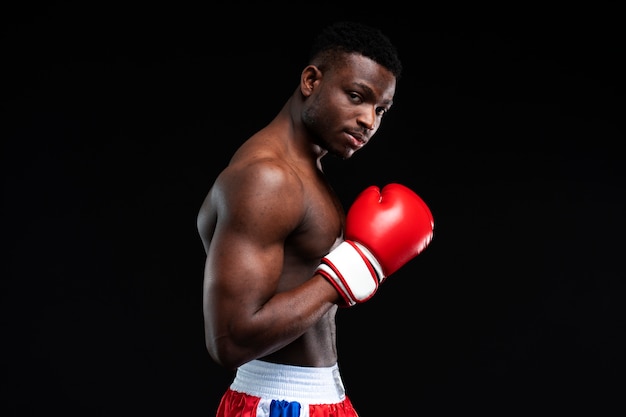 Medium shot man practicing boxing