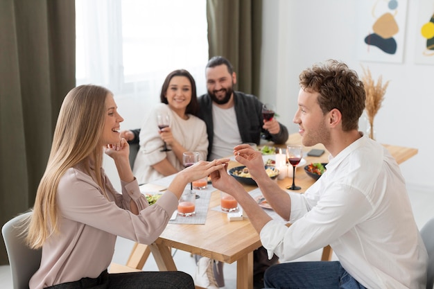 Medium shot man proposing to woman