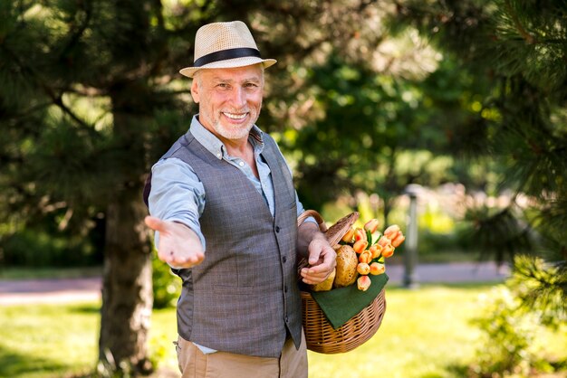 Medium shot man reaching out his hand to camera