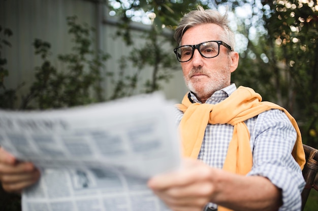 Medium shot man reading news