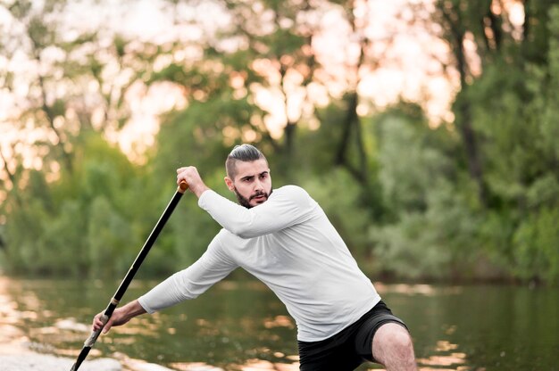 Medium shot man rowing