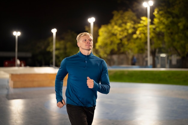 Free photo medium shot man running outdoors