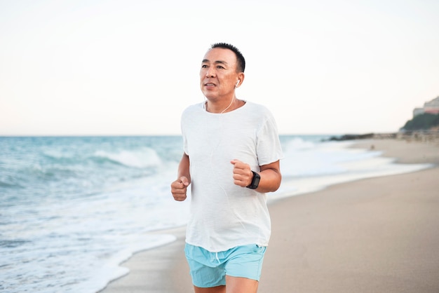 Medium shot man running on shore