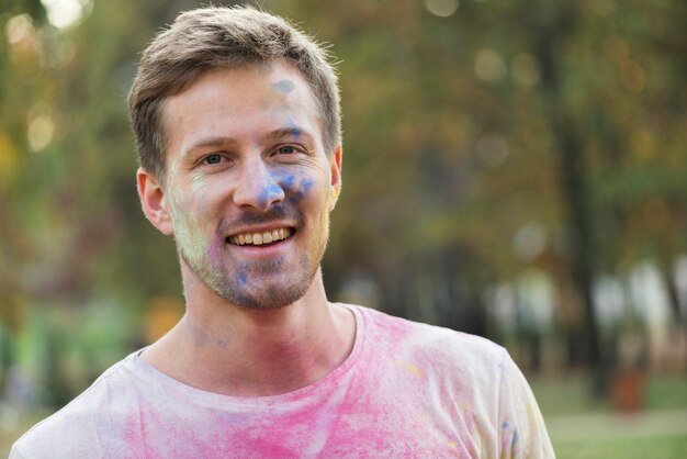 Medium shot of man's colored face