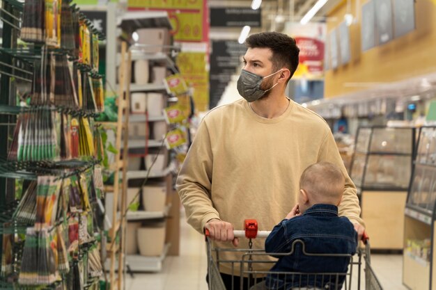 Medium shot man shopping with child