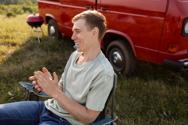 Free photo medium shot man sitting on chair