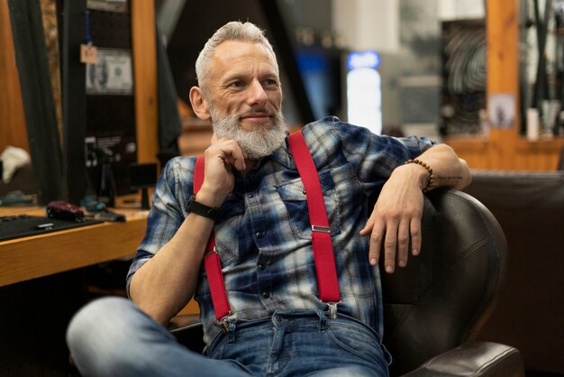 Medium shot man sitting on chair