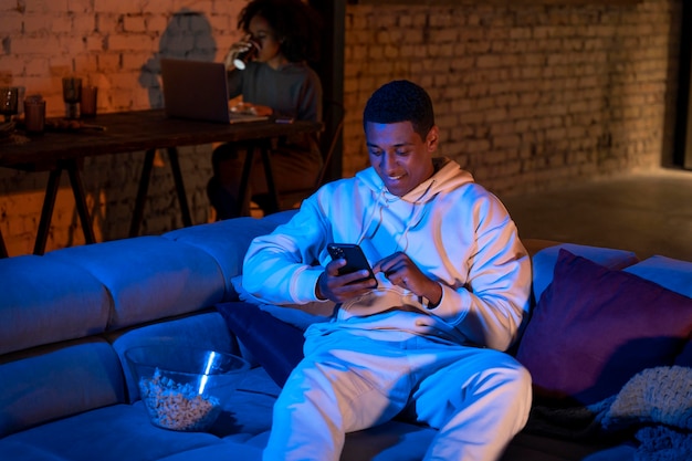 Medium shot man sitting on couch