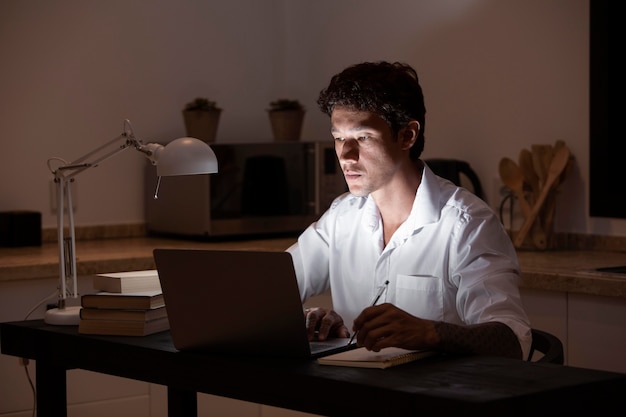 Medium shot man sitting at desk