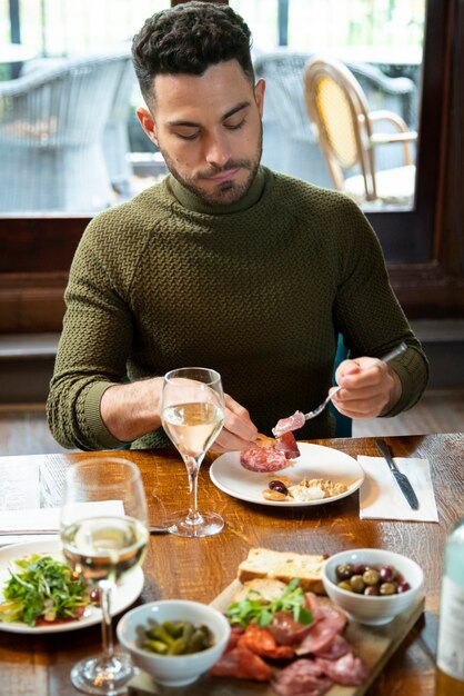 Medium shot man sitting at table