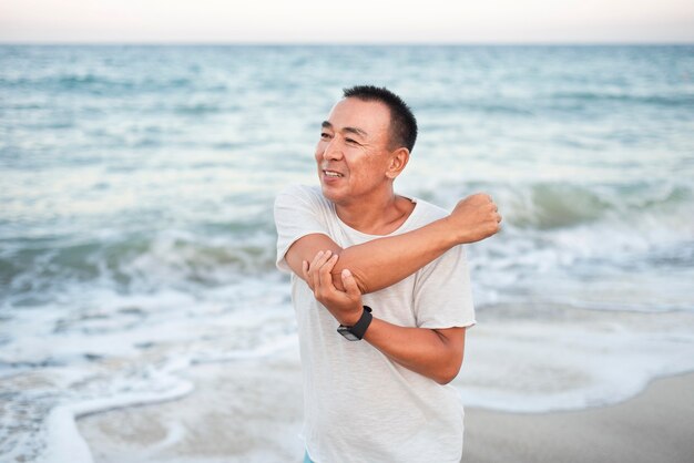 Medium shot man stretching arm