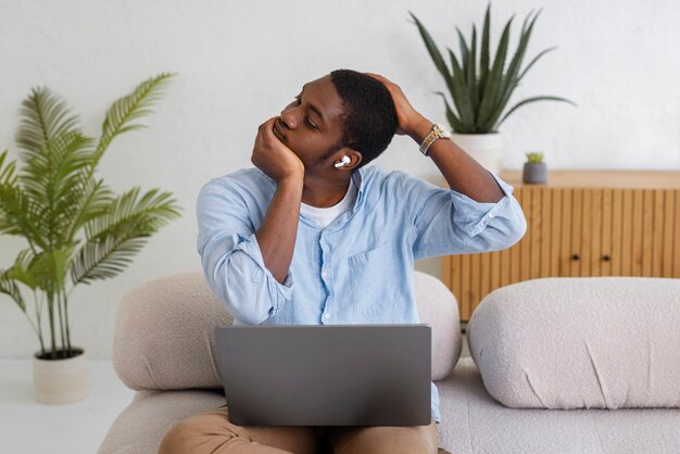 Free photo medium shot man stretching at home