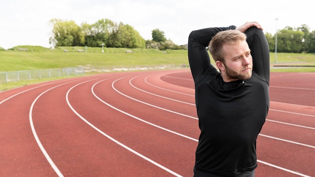 Medium shot man stretching